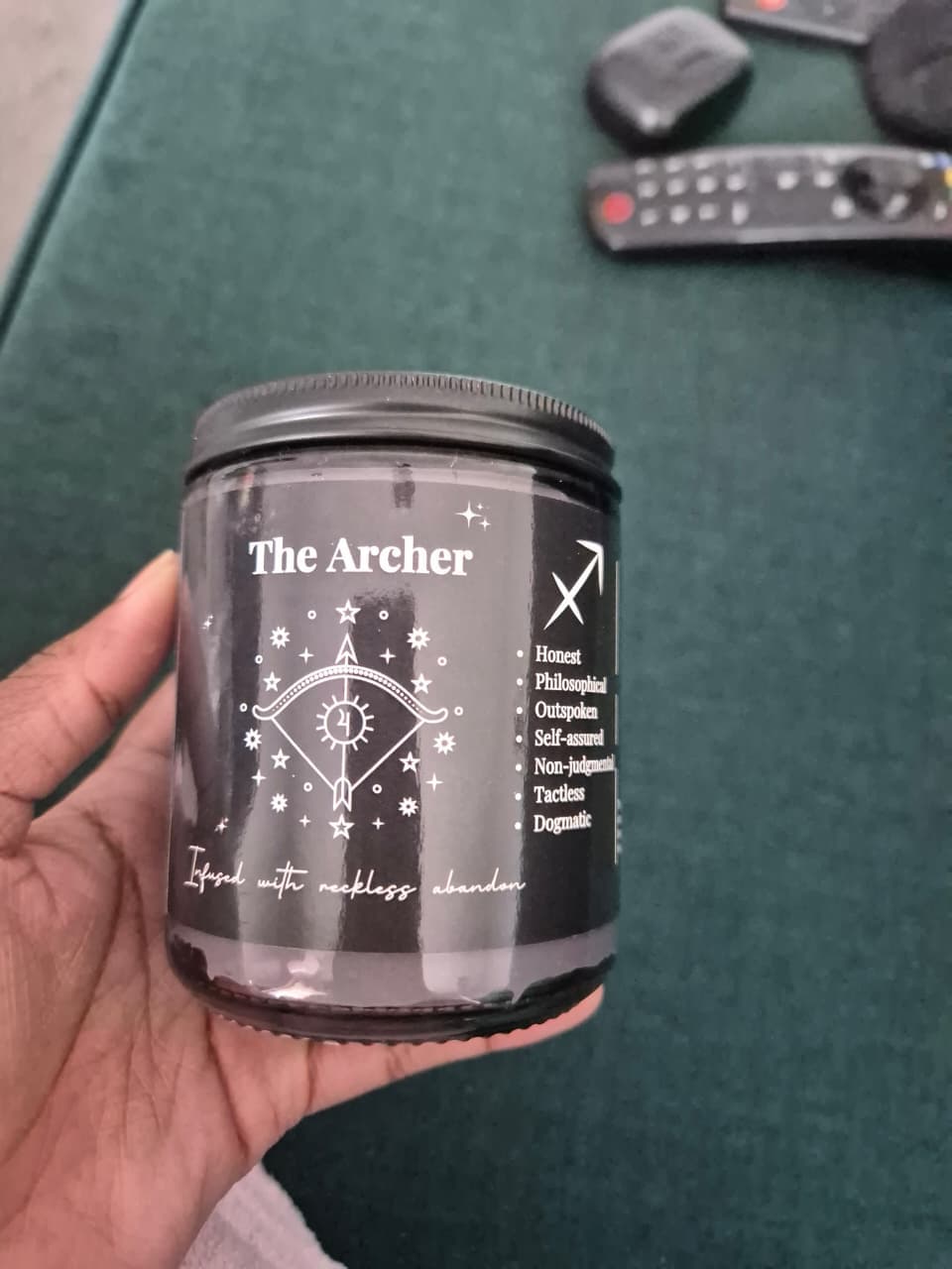 The Free Spirit vessel, its Archer label facing the camera, held in a hand at home.